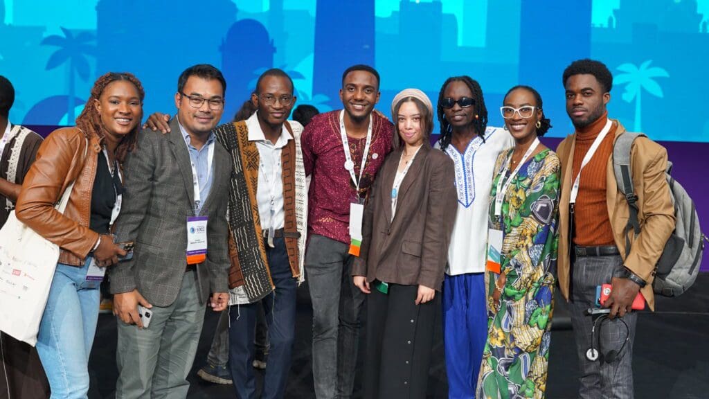 Group photo of youth champions from the 2022 Summit during the final keynote celebration
